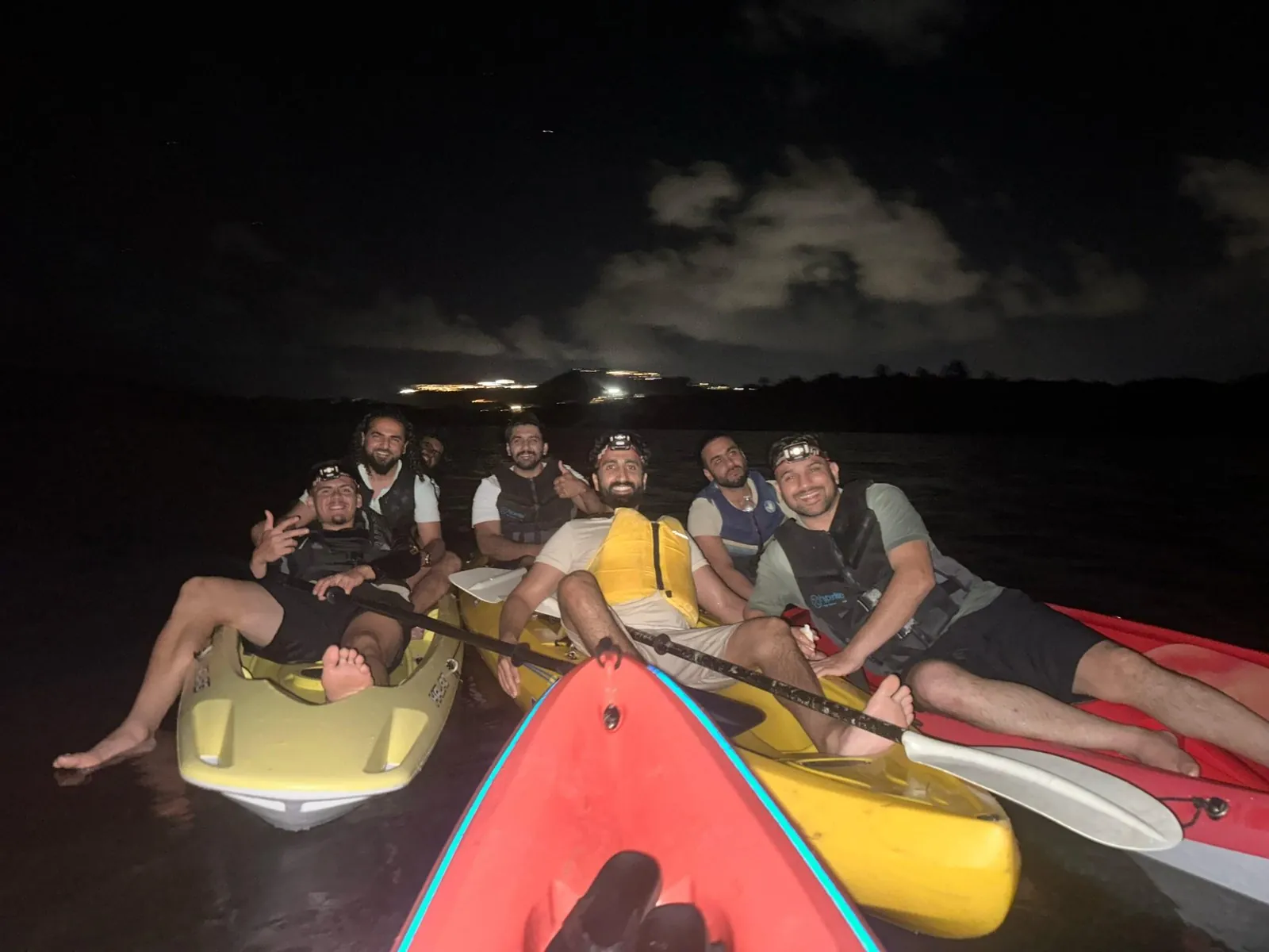 Group of guests in kayaks with headlamps during a night bioluminescent bay tour at Laguna Grande, Fajardo, Puerto Rico